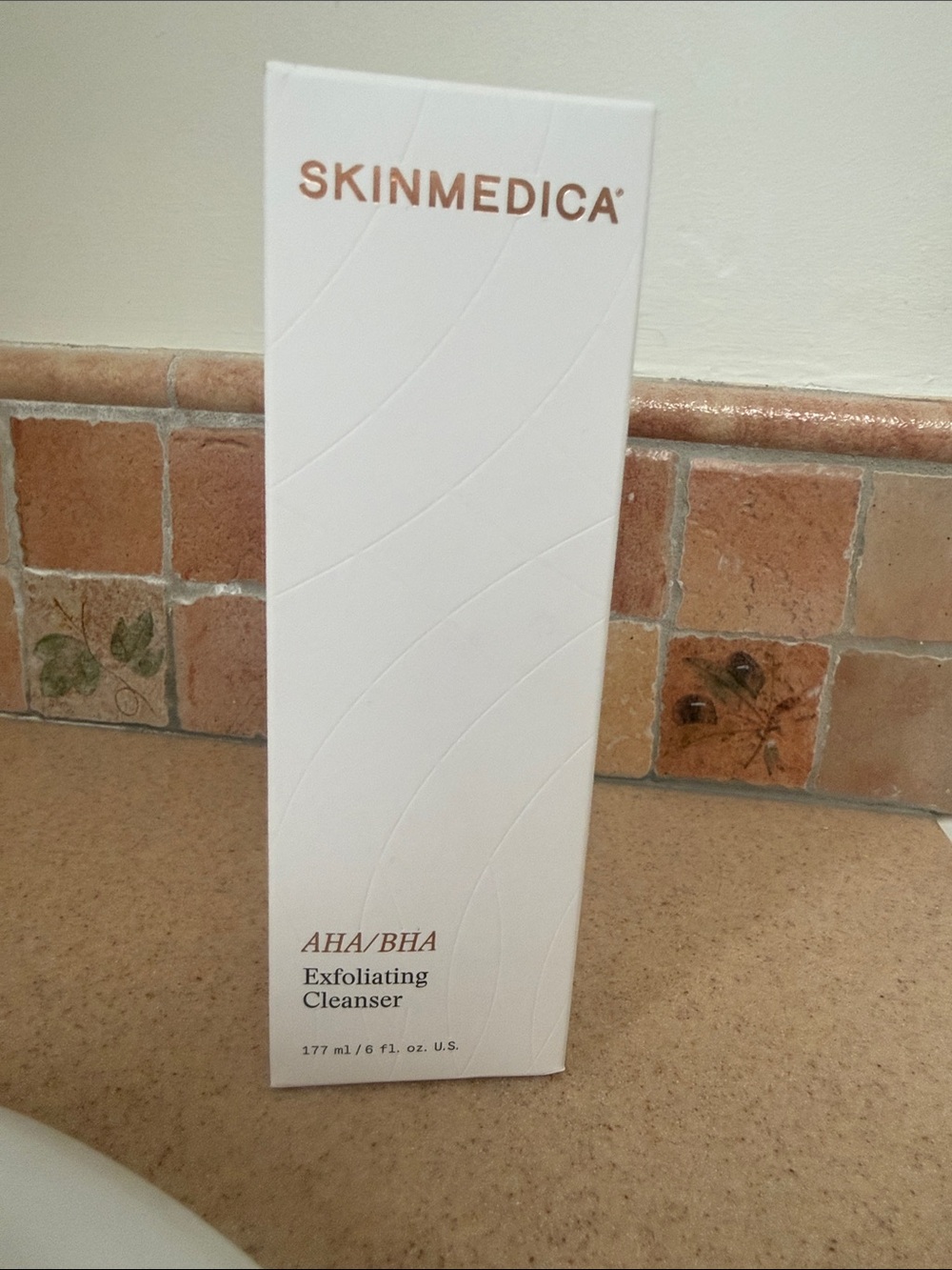 SkinMedica AHA/BHA Exfoliating Cleanser in White with Rose Gold Text